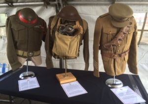 L-R 1948 Pattern Battle Dress Blouse and CLC Helmet; 1939 Patter Battle Dress Blouse, Webbing with Gas Mask Bag and Helmet; and 1903 Pattern Service Dress, Cloth Cap, Leather Belt and Bandoleer. 
